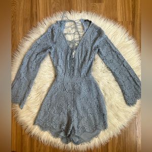 Miss Lola blue romper with lace front and back. Size small